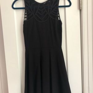 Black dress with mesh details by Aqua